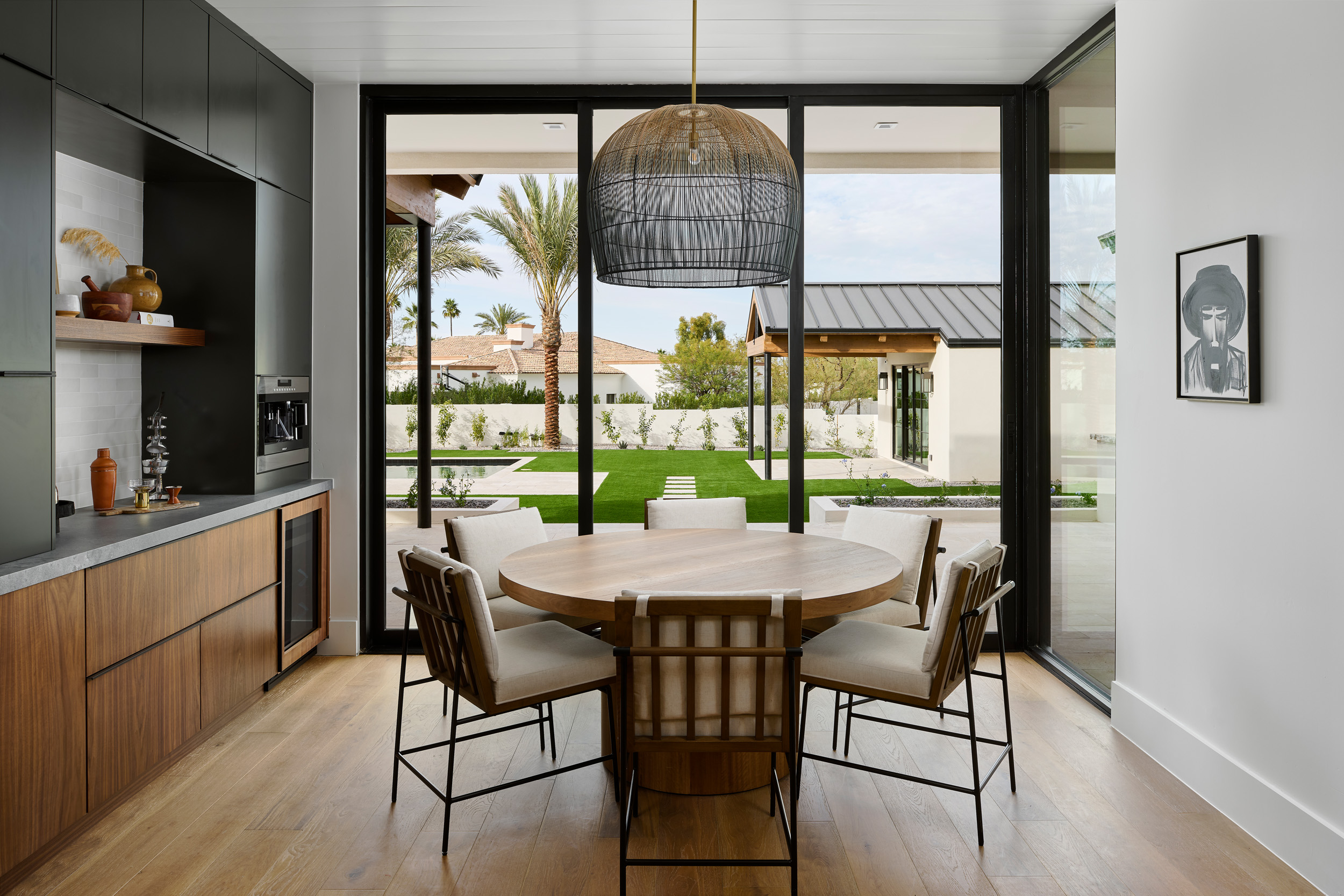A dining nook with statement lighting.