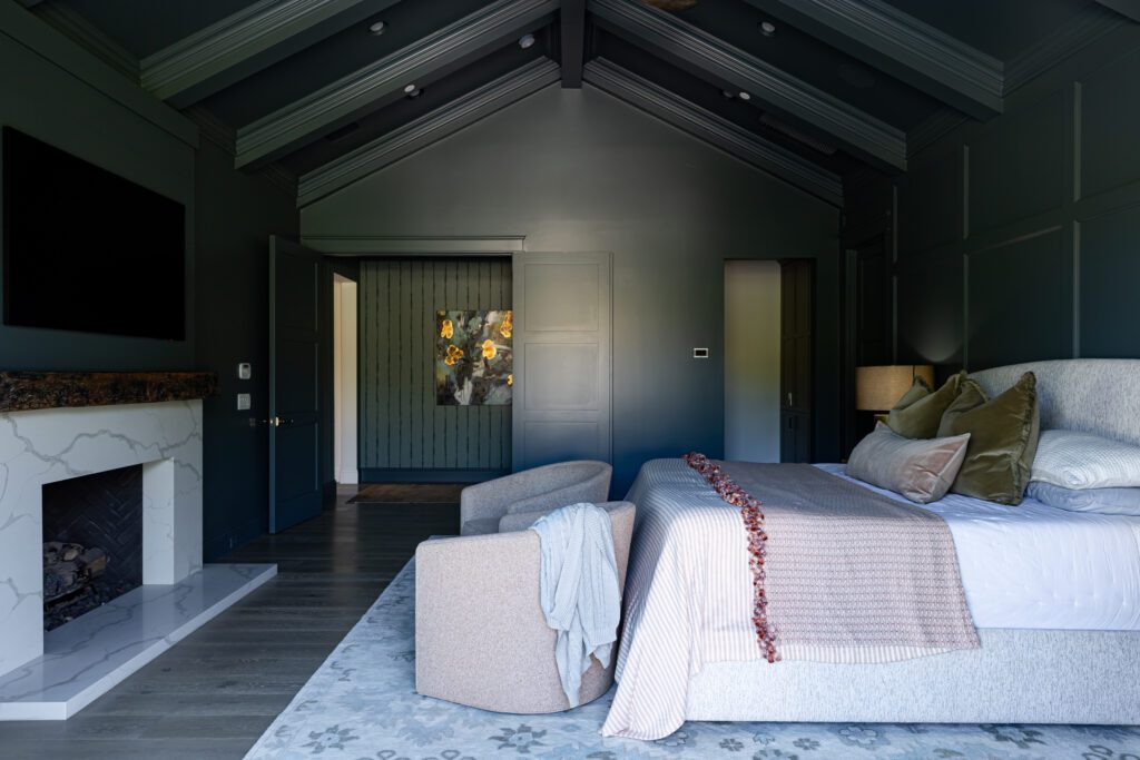 Saturated teal bedroom with layered textiles by Smyth House Interior Design