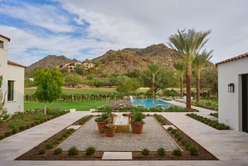 Luxury Arizona backyard designed by Smyth House featuring pool, desert landscaping, and mountain views