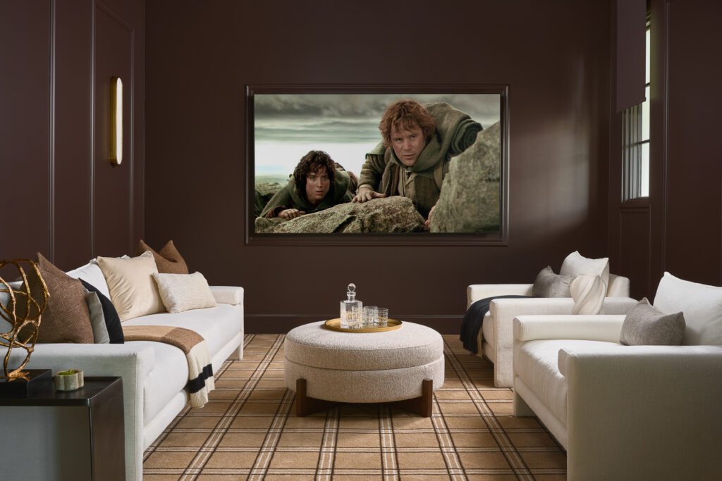 Luxury home theater with moody brown walls, plush seating, and cozy design by Smyth House